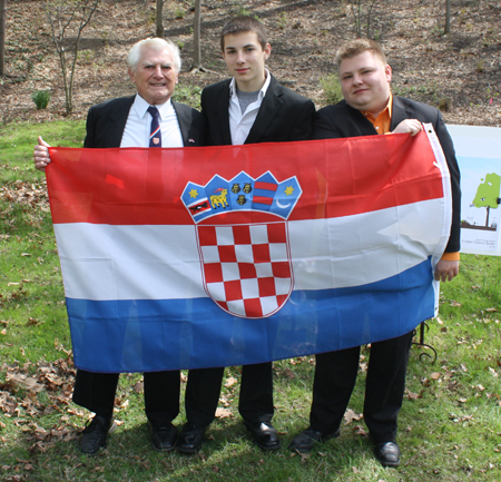 Jerry Malinar with two of his grandsons Jessie Rogers and Kevin Kleinsmith  with the Croatian Flag