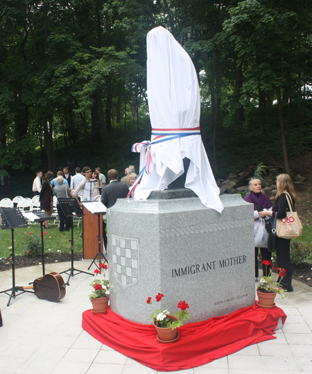 Immigrant Mother statue covered for unveiling