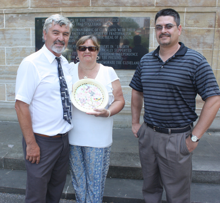 Paul Burik, Ludmilla Hybnar and Eric Jirouch with the plate crafted by Frank Jirouch
