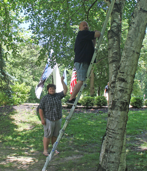 Raising the banner over the monument