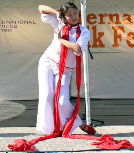 Yin Tang performs a Red Ribbon Dance