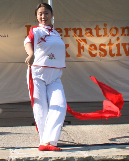 Yin Tang performs a Red Ribbon Dance