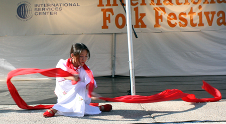 Yin Tang performs a Red Ribbon Dance