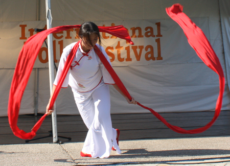 Yin Tang performs a Red Ribbon Dance