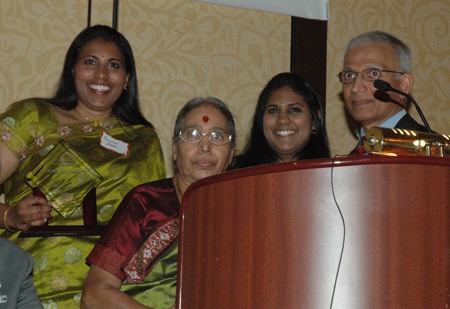 Emani Family accepts award