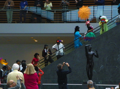Members of the musical group Progeny from Shaw High School and Heritage Middle School paraded through the new Ames Family Atrium with the Quixote puppets from Parade the Circle.