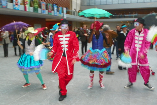 Members of the musical group Progeny from Shaw High School and Heritage Middle School paraded through the new Ames Family Atrium with the Quixote puppets from Parade the Circle.