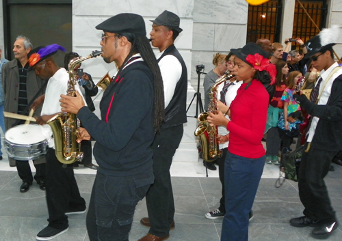 Members of the musical group Progeny from Shaw High School and Heritage Middle School paraded through the new Ames Family Atrium with the Quixote puppets from Parade the Circle.