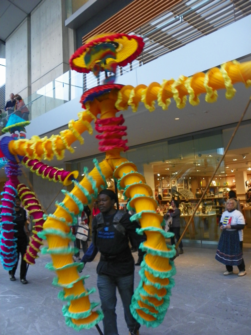 Members of the musical group Progeny from Shaw High School and Heritage Middle School paraded through the new Ames Family Atrium with the Quixote puppets from Parade the Circle.