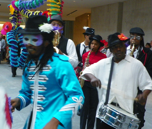 Members of the musical group Progeny from Shaw High School and Heritage Middle School paraded through the new Ames Family Atrium with the Quixote puppets from Parade the Circle.