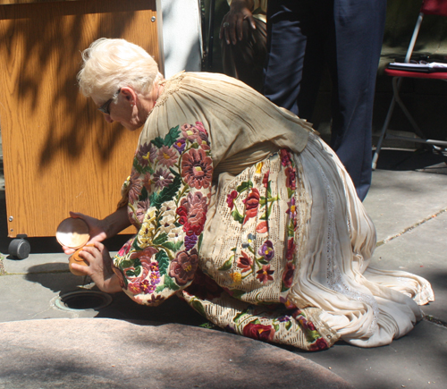 Mila Mandic from the Cleveland Croatian community deposited soil from Croatia to mix with soil of other nations