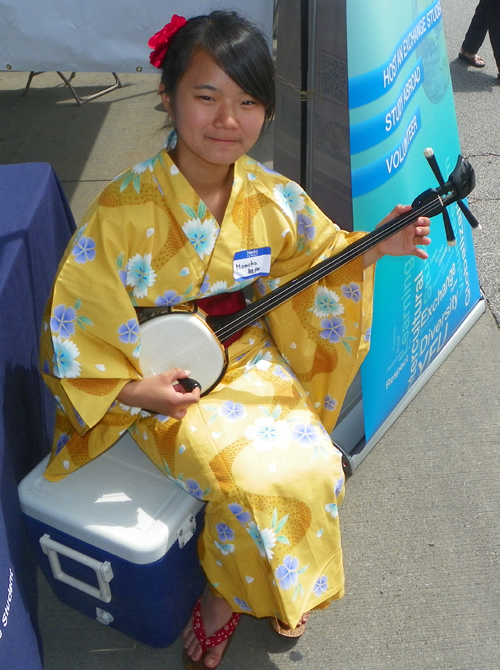 Momoka playing a sanshin