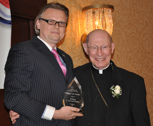Consul General of Slovenia Jure Zmauc hands Bishop Edward Pevec his Cleveland International Hall of Fame award