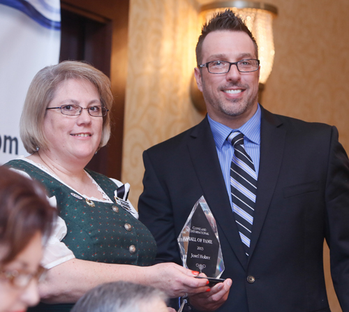 Margot Maurer gives Josef Holzer's Cleveland International Hall of Fame award to Joe's grandson David Jung