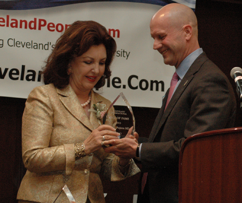 Len Komoroski gives Maria Pujana her Cleveland International Hall of Fame award