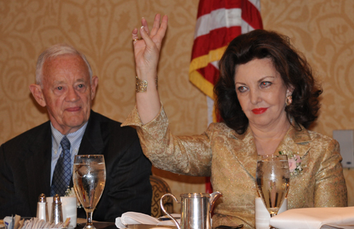 Inductees Jack Coyne and Maria Pujana on stage