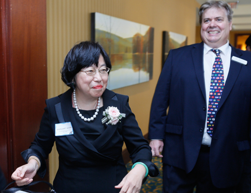 Margaret Wong enter the Grand Ballroom with Dan Hanson