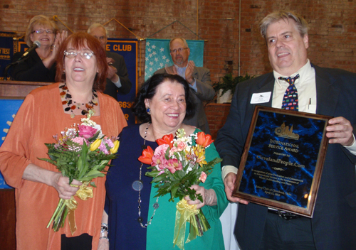 Debbie Hanson, Pat Hanson and Dan Hanson with award