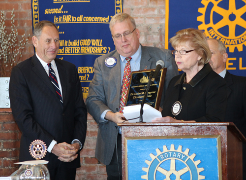 Toby Cosgrove receives award from Paul Qua and Ingrida Bublys