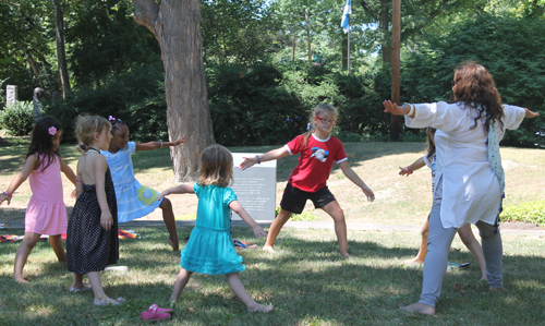 Learning yoga on Kid's Day in the India Cultural Garden