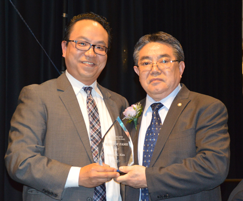 Ki Kim and Sam Kim with Hall of Fame award