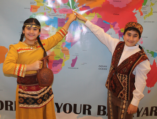 Tigran Baghdasaryan and Ellena Baghdasaryan Posing with the map of Armenia