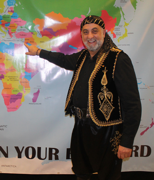 Nemer Saueidi Posing with a map of Lebanon