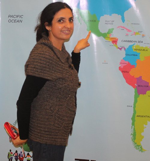 Posing with a map of Mexico