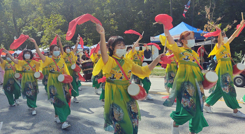 Chinese dancers in Parade of Flags at One World Day 2021