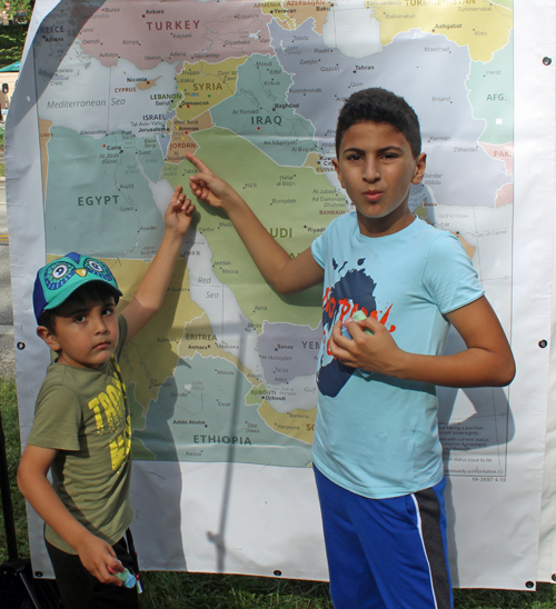 Boy pointing at ClevelandPeople.com map of Jordan