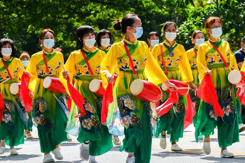 Chinese dancers in Parade of Flags at One World Day 2021