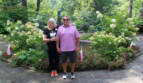 Connie Adams and her husband in front of the fountain