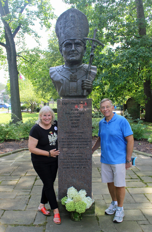 Connie Adams and Richard Konisiewicz in front of bust of John Paul II
