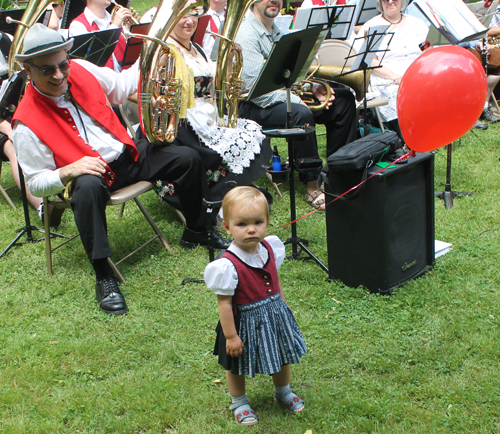 Baby with red balloon