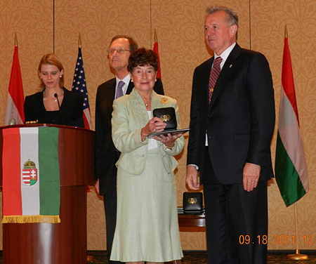 Jeanette Grasselli Brown accepts the President's Medal Of Merit from Hungarian President Pl Schmitt 