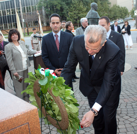 Hungarian President Pl Schmitt in front of the Freedom Fighter statue in Cleveland Ohio