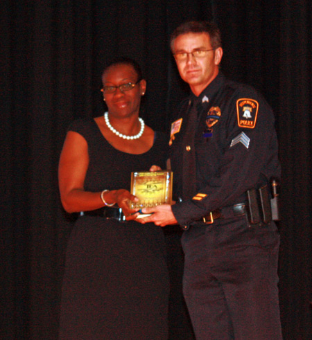 Independence Police Sergeant Christopher Cross with Senator Nina Turner
