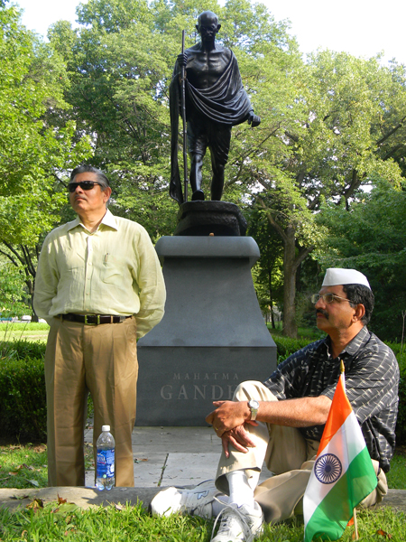 Sudarshan Sathe and Michael Sreshta in front of Gandhi statue