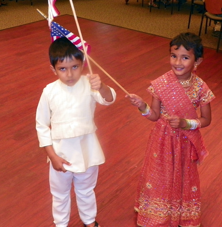 Sumeet Chakraborty and Olivia Nath  - Young boy and girl with flags