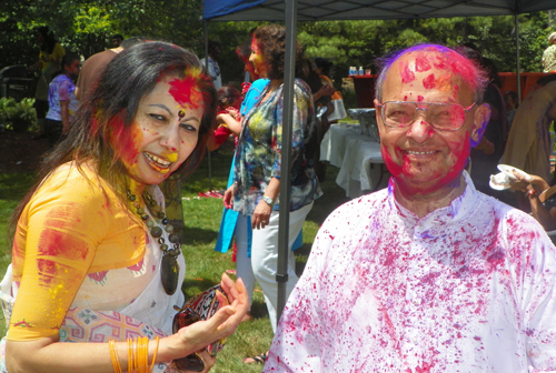 People covered in Holi colors