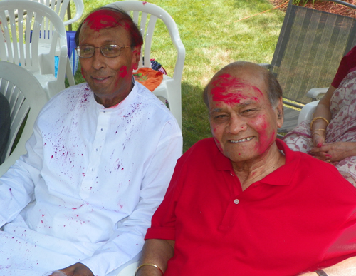 People covered in Holi colors