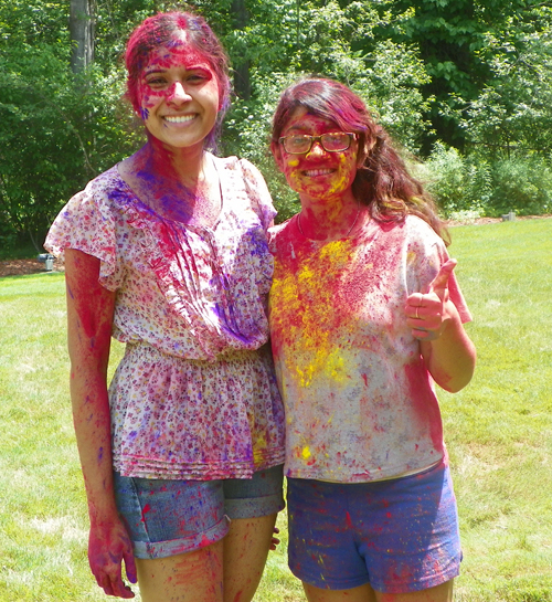 People covered in Holi colors