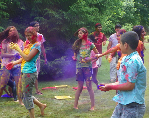 People covered in Holi colors