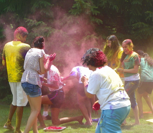 People covered in Holi colors