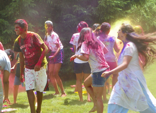 People covered in Holi colors