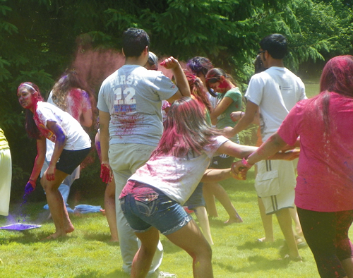 People covered in Holi colors