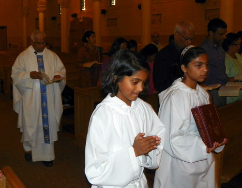 Procession into St Agnes Church in Elyria