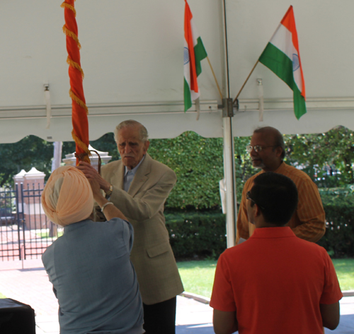 untying of the flags of India and the United States by Om Julka and Paramjit Singh