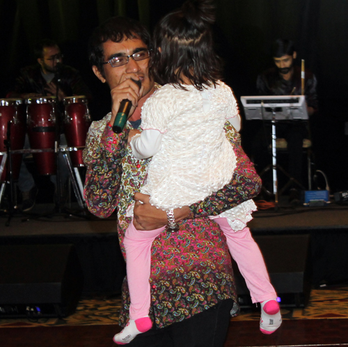 Singer with little girl
