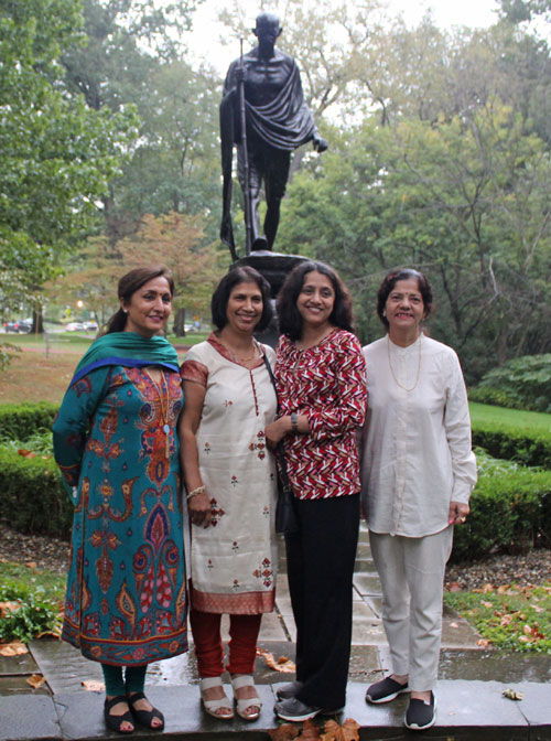 Posing with the statue of Gandhi